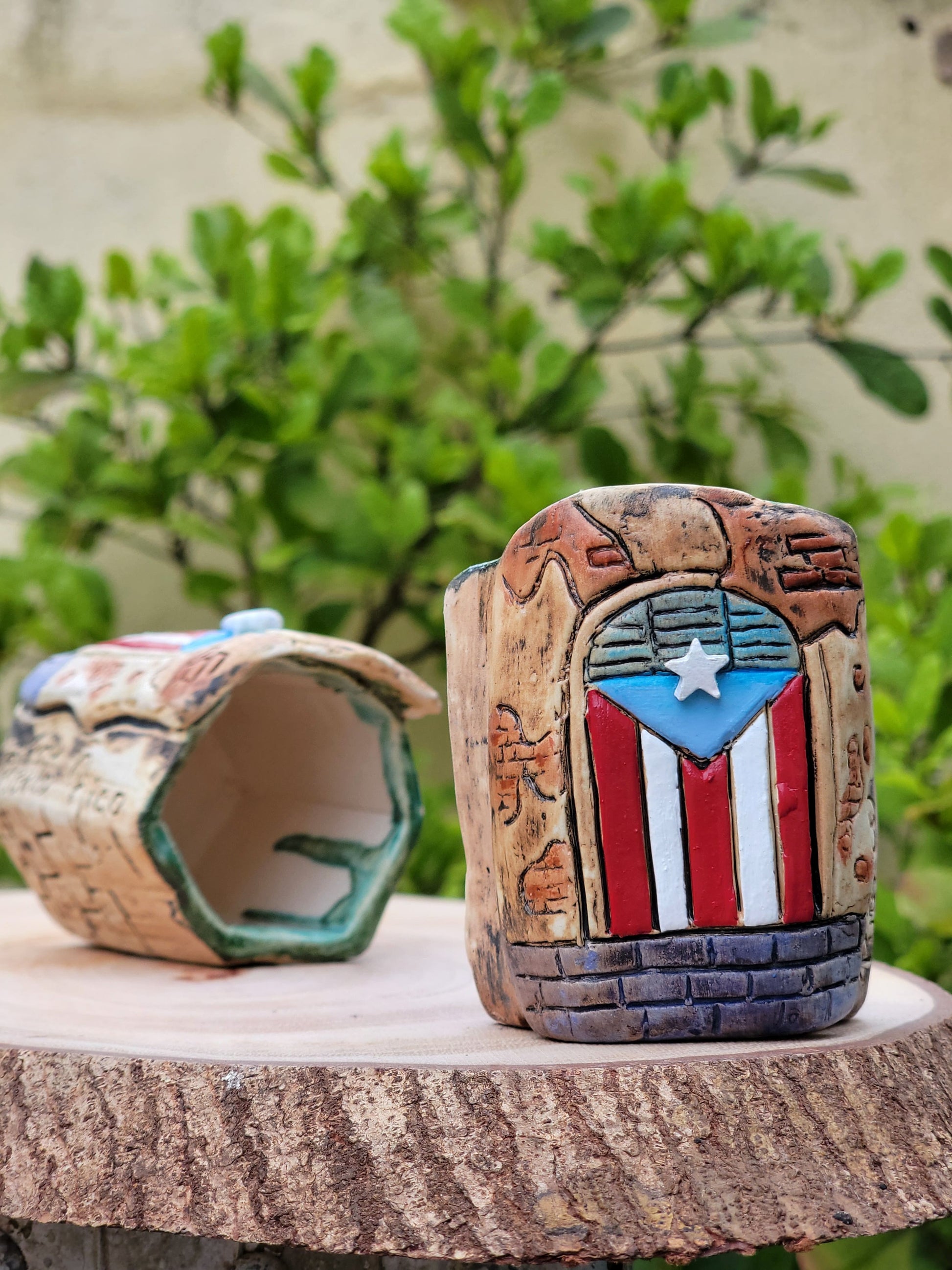 Hexagonal ceramic holder with Puerto Rican flag design on a wooden surface