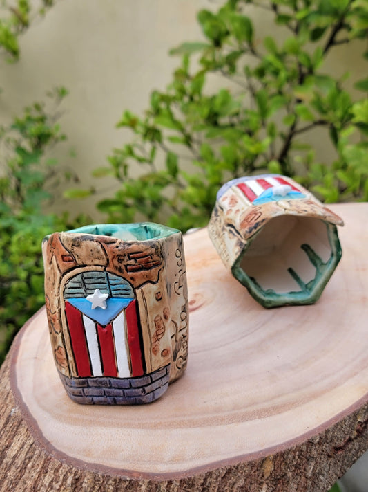 Hexagonal ceramic holder with Puerto Rican flag design on a wooden surface