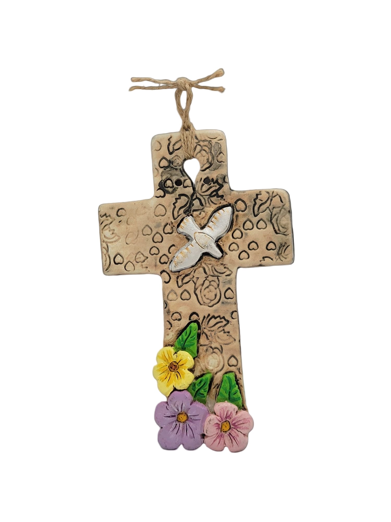 Decorative cross with floral  designs on a light gray background