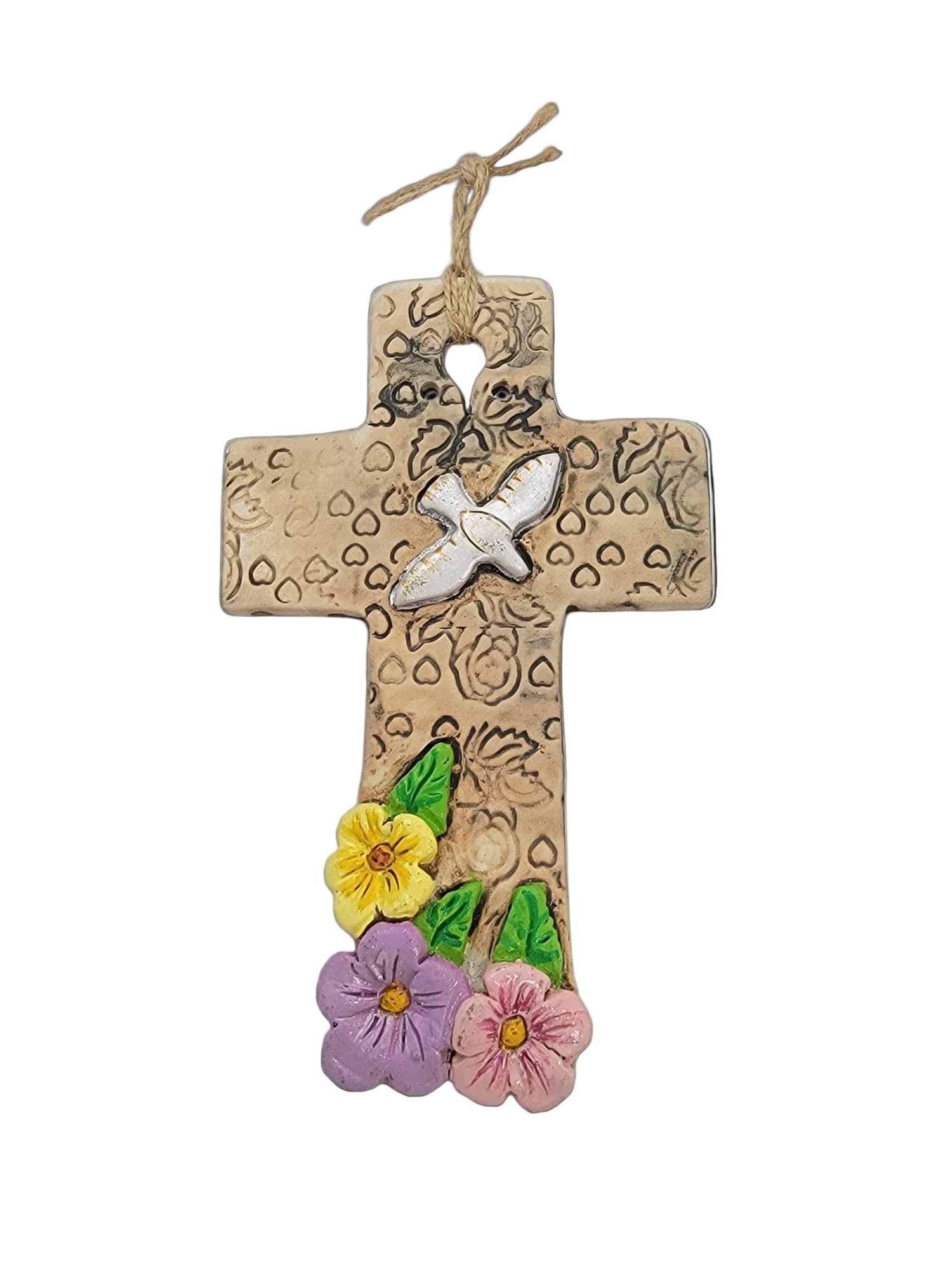 Decorative cross with floral designs on a white background