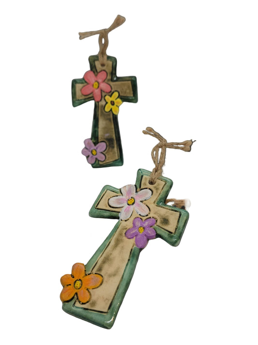 Decorative crosses with colorful flowers on a white background